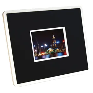 A small framed cityscape photo with a black mat and white border.