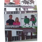 Cube with photos of people, cartoon sheep, houses, and Dutch text about housing types.