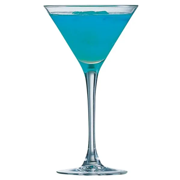 A martini glass filled with a bright blue cocktail against a white background.