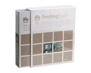 White Finishing Touch box with beige square tiles and a small home icon on the front.