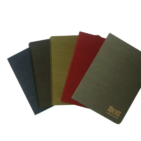 Four fabric-covered notebooks in blue, brown, yellow, red, and gray, fanned out.