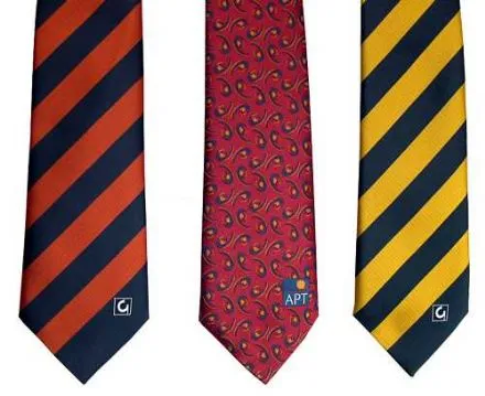 Three neckties: orange/black stripes, red paisley pattern, yellow/black stripes.