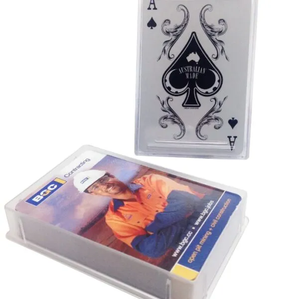 A deck of cards in a plastic case with an ace of spades card displayed upright behind it.