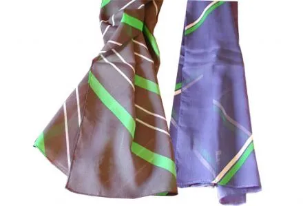 Two silky scarves with green and white diagonal stripes on brown and purple backgrounds.