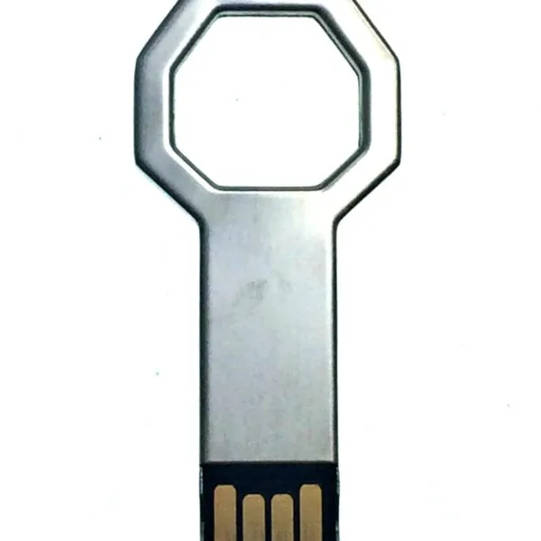 A USB flash drive shaped like a key, with a metallic finish, on a white background.