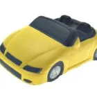 Yellow toy convertible car with black interior and silver wheels, viewed from the front side.