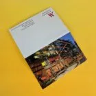 A Marriott hotel key card holder on a yellow surface.