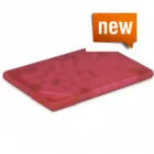 Red rectangular mat with a textured surface and a new label in the top right corner.