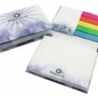 Three notepads with white paper and colorful sticky tabs in blue, green, yellow, orange, and pink.