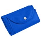 A small, blue, folded fabric pouch with a button closure.