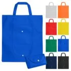 Reusable tote bags in various colors, shown unfolded and folded with a snap button closure.