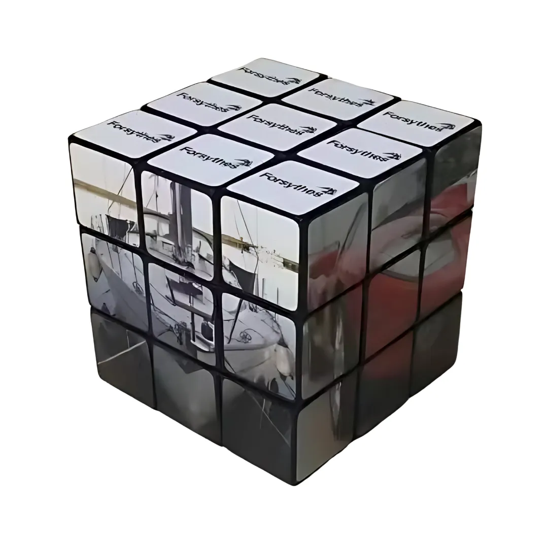 The Rubiks 3x3 Cube is depicted with images of a boat and the FedEx logo on various squares, slightly rotated to reveal different angles and showcase how the images align with the cubes structure.