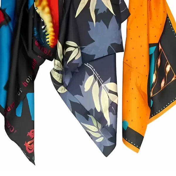 Ladies Customised Scarves hanging, displaying leaves and abstract designs.