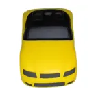 The Sports Car Yellow is a stylized yellow sports car with a sleek black convertible top and windshield, viewed from above. Its minimal detailing gives it a toy-like or model vehicle appearance against a plain white background.