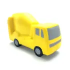 A yellow stress ball shaped like a cement mixer truck, featuring gray windows and wheels, is displayed against a white background. Its simplistic design resembles plastic or rubber, with charming, minimal details. Product: Stress Balls - Cement Truck.