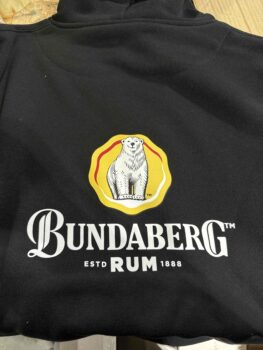 Personalised hoodie featuring Bundaberg Rum logo and polar bear graphic on the back.