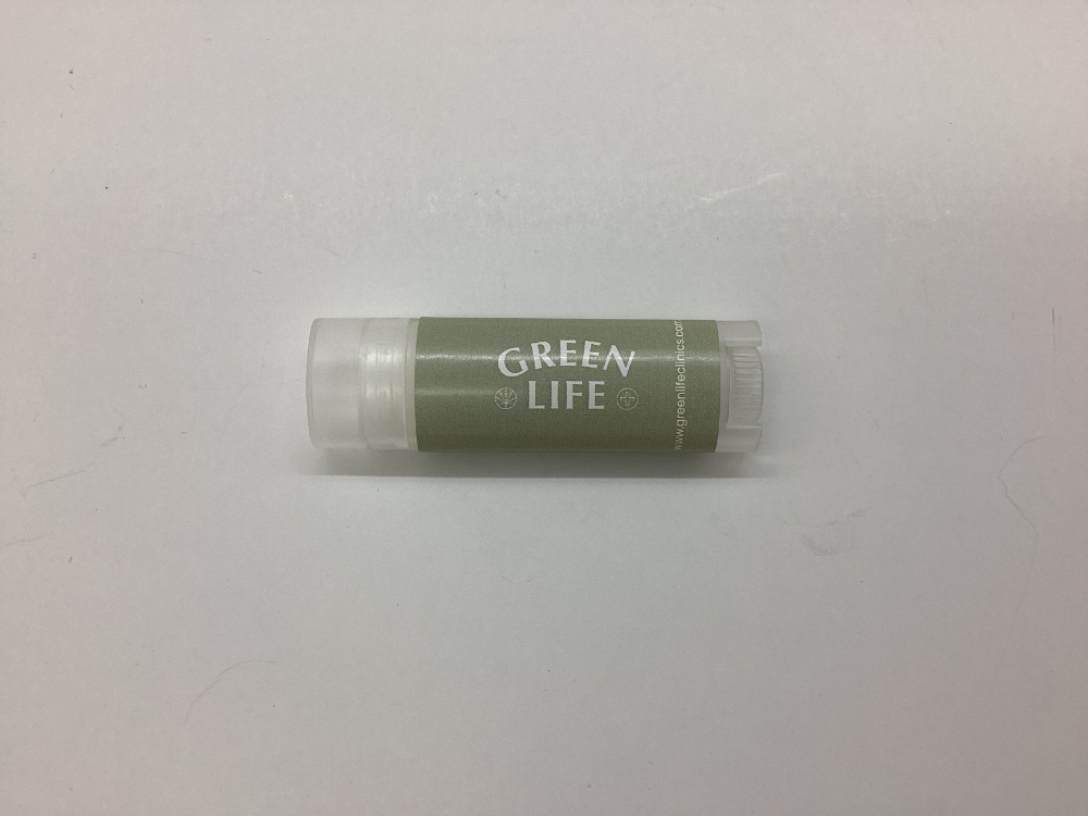 A tube of lip balm labeled GREEN LIFE from Green Life Clinics on a plain white background.