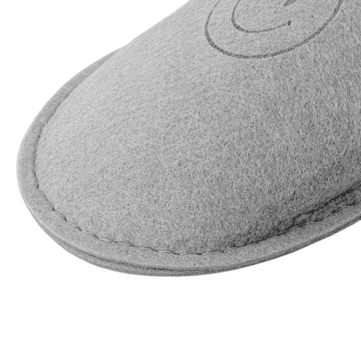 Close-up of Selene Felt Slippers - rush in grey felt, with visible stitching and part of logo.